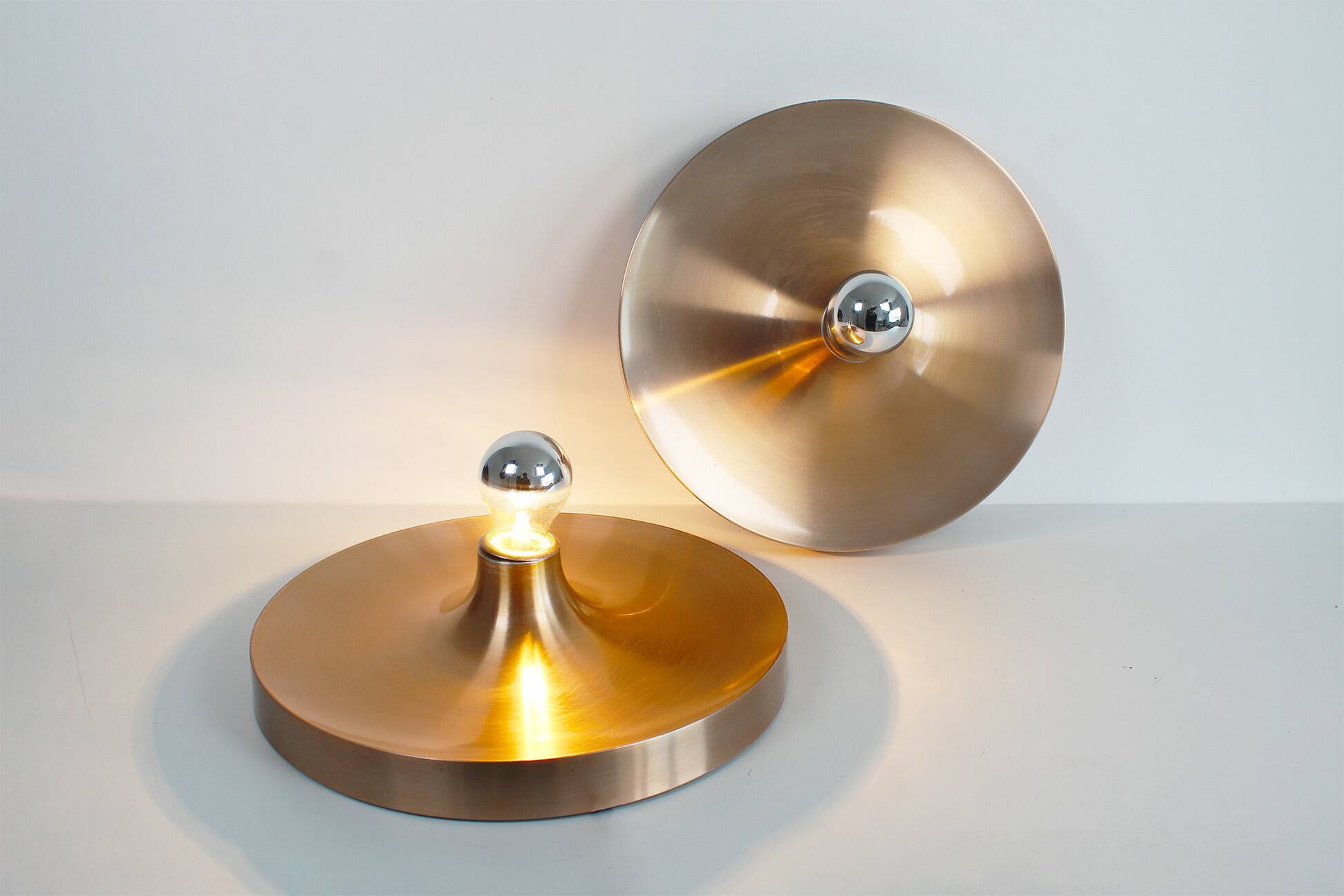 Pair of medium sized (35cm) rose gold Honsel Disc sconces selected by Charl