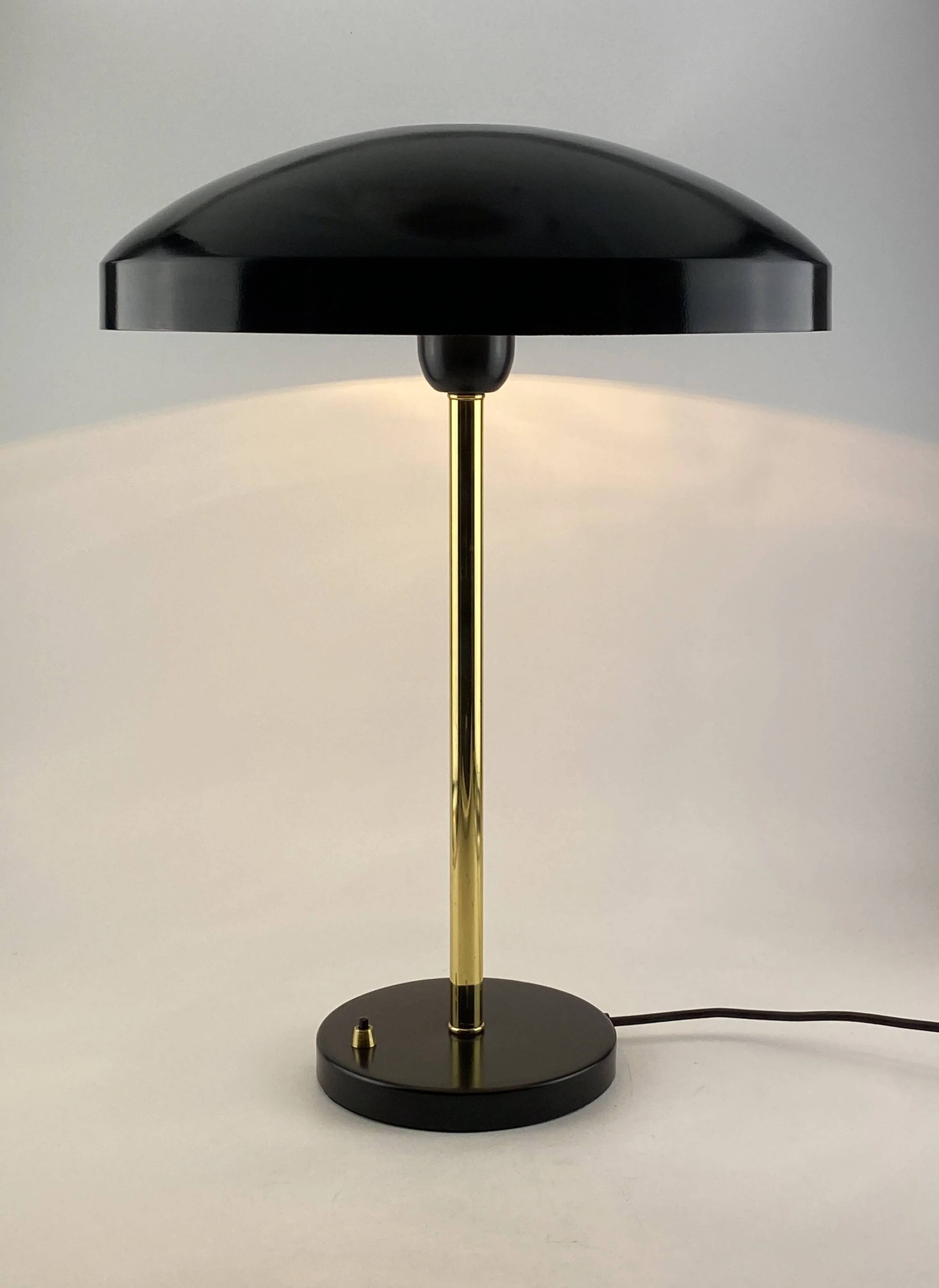 Rare black and gold UFO table lamp by Louis Kalff for Philips.