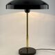 Rare black and gold UFO table lamp by Louis Kalff for Philips.