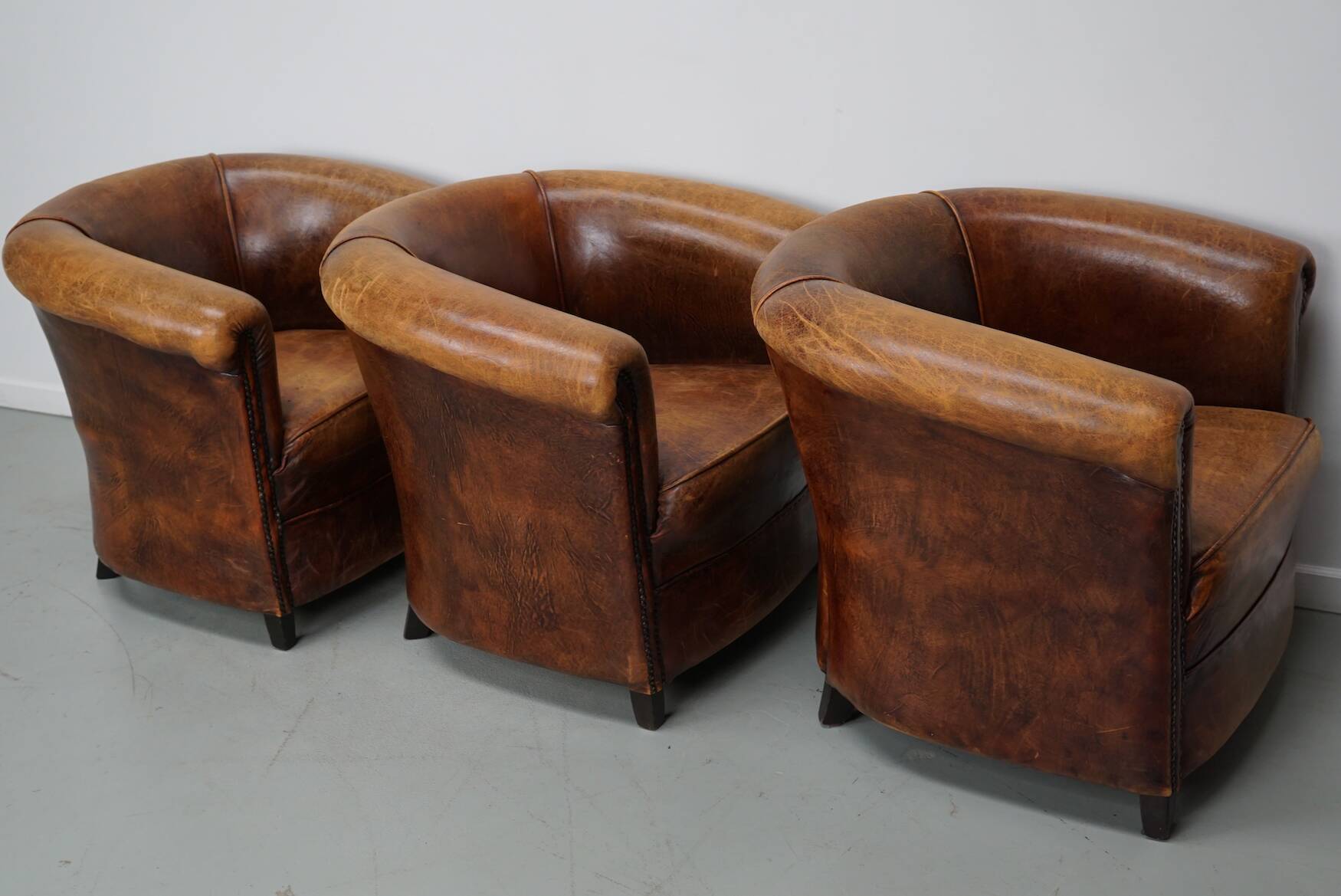 Fauteuils club vintage hollandais en cuir cognac, lot de trois