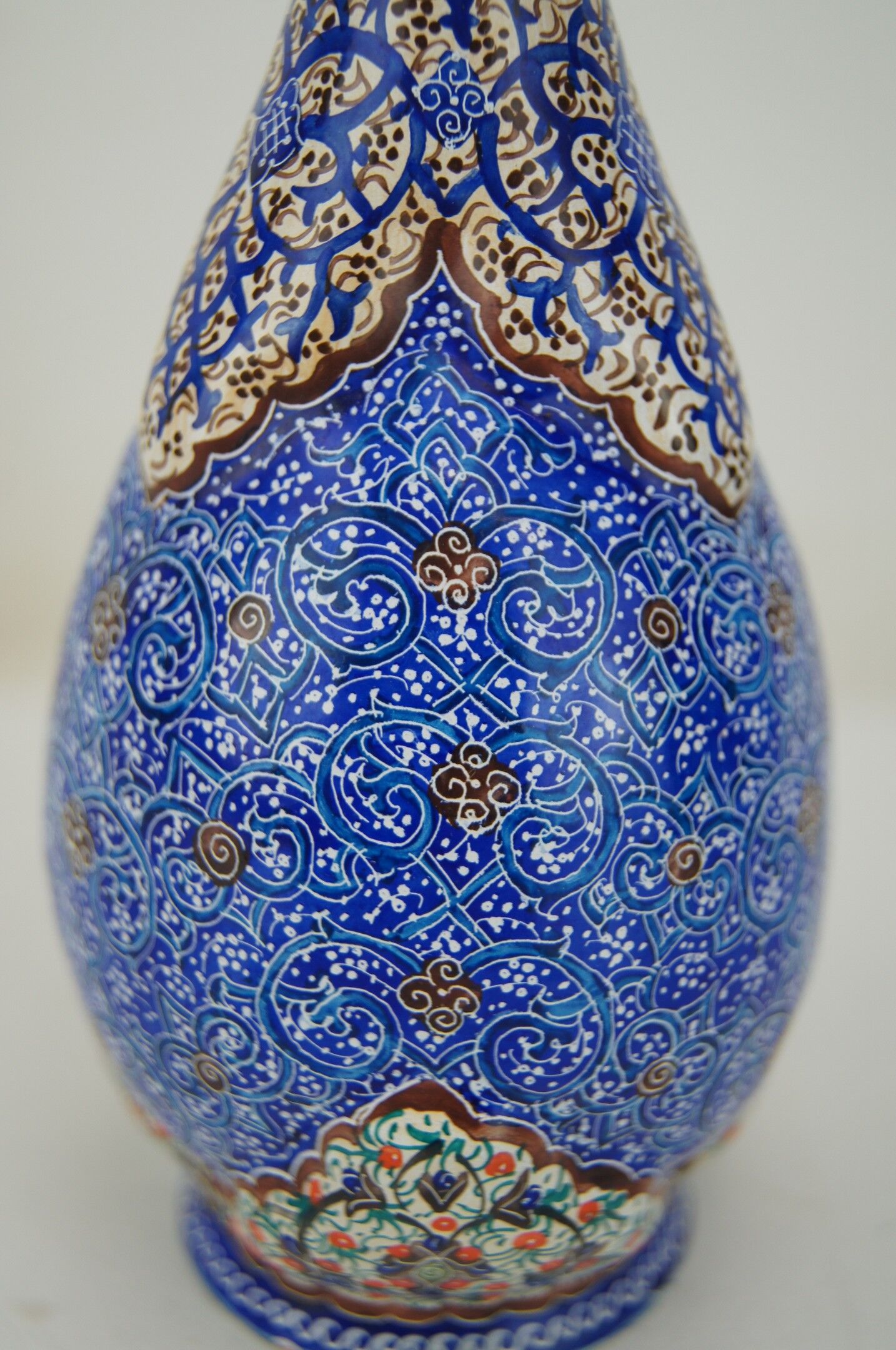 Piriform vase with a flared metal collar enamelled with a polychrome decoration, marked "Amini Iran" on the reverse.