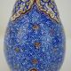 Piriform vase with a flared metal collar enamelled with a polychrome decoration, marked "Amini Iran" on the reverse.