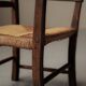 Old peasant armchair in solid wood and woven straw – Auvergne, 19th century.