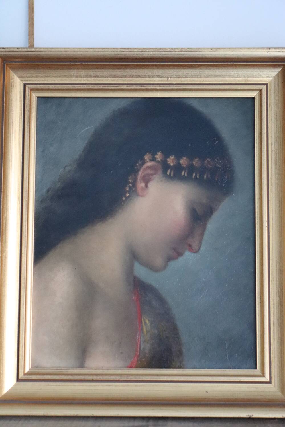 Old oil portrait of a woman on panel