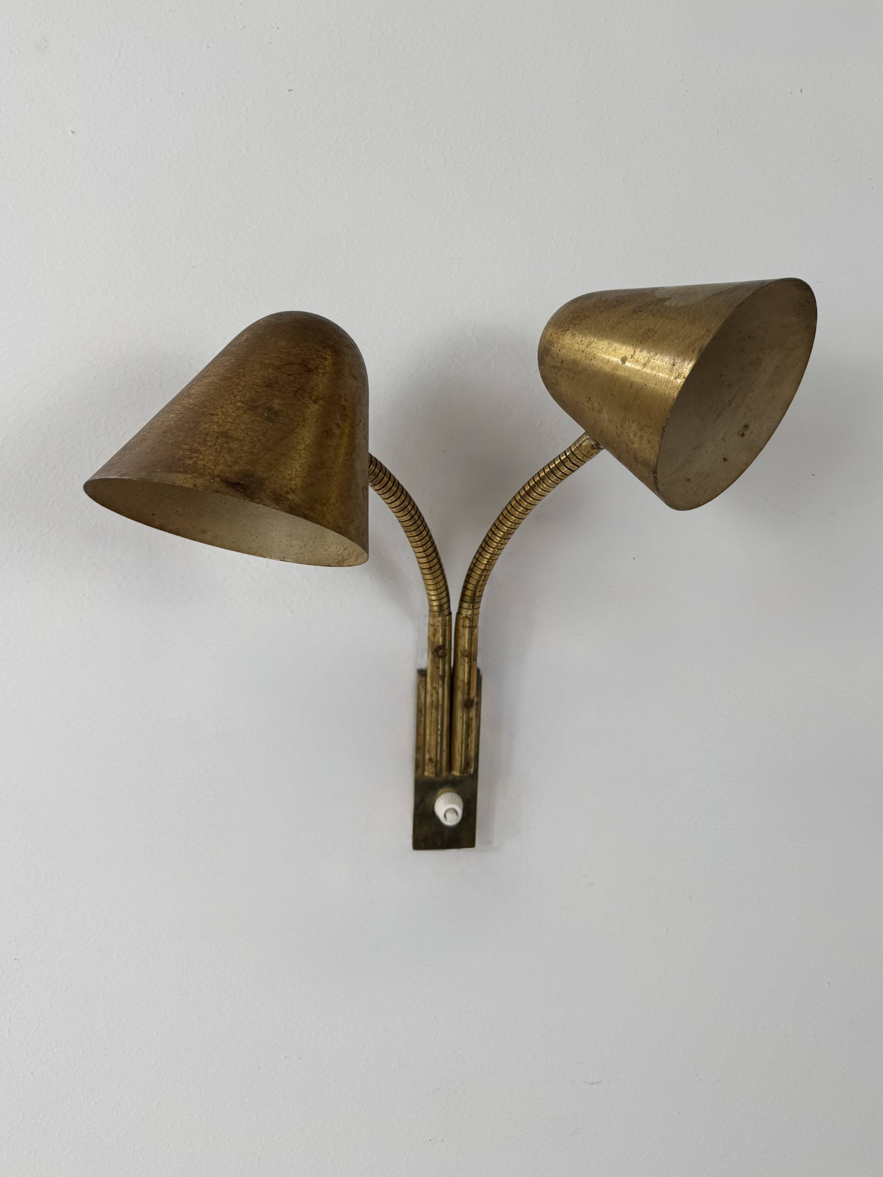 Double orientable vintage patinated brass wall light, Jacques Biny France 1950.