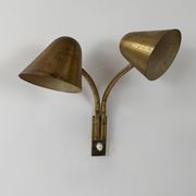 Double orientable vintage patinated brass wall light, Jacques Biny France 1950.