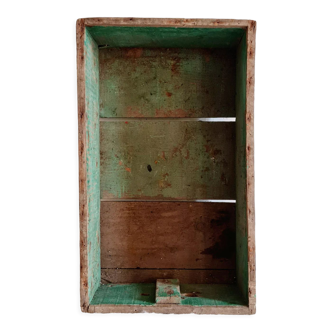 Old wooden box with green patina