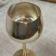 Green stemmed, brass chalices