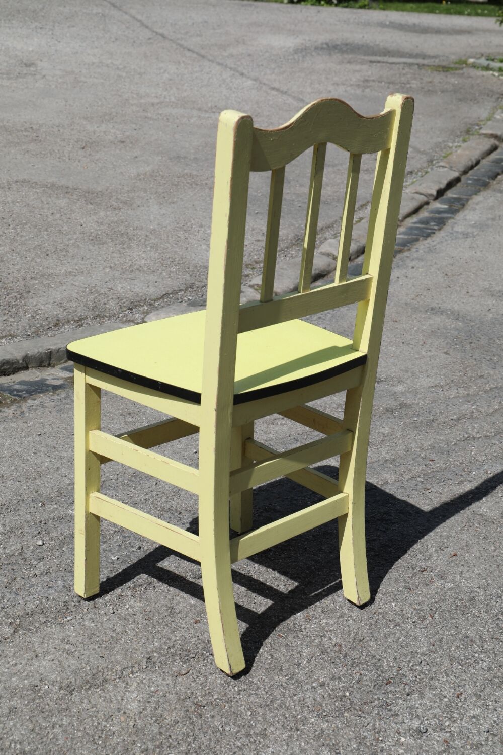 Formica and yellow wood chair