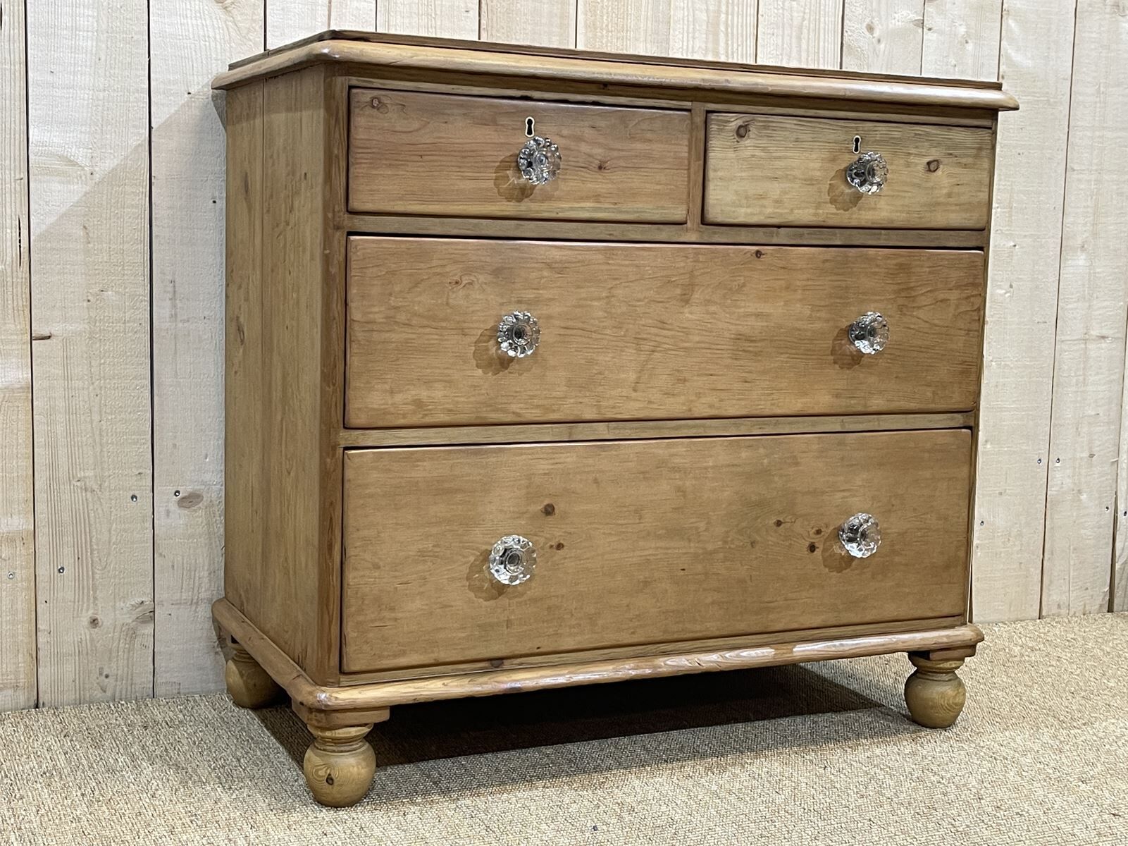 English chest of drawers in nineteenth century fir with its glass buttons