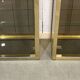 Pair of display cases in gilded chrome and smoked glass - 1980s