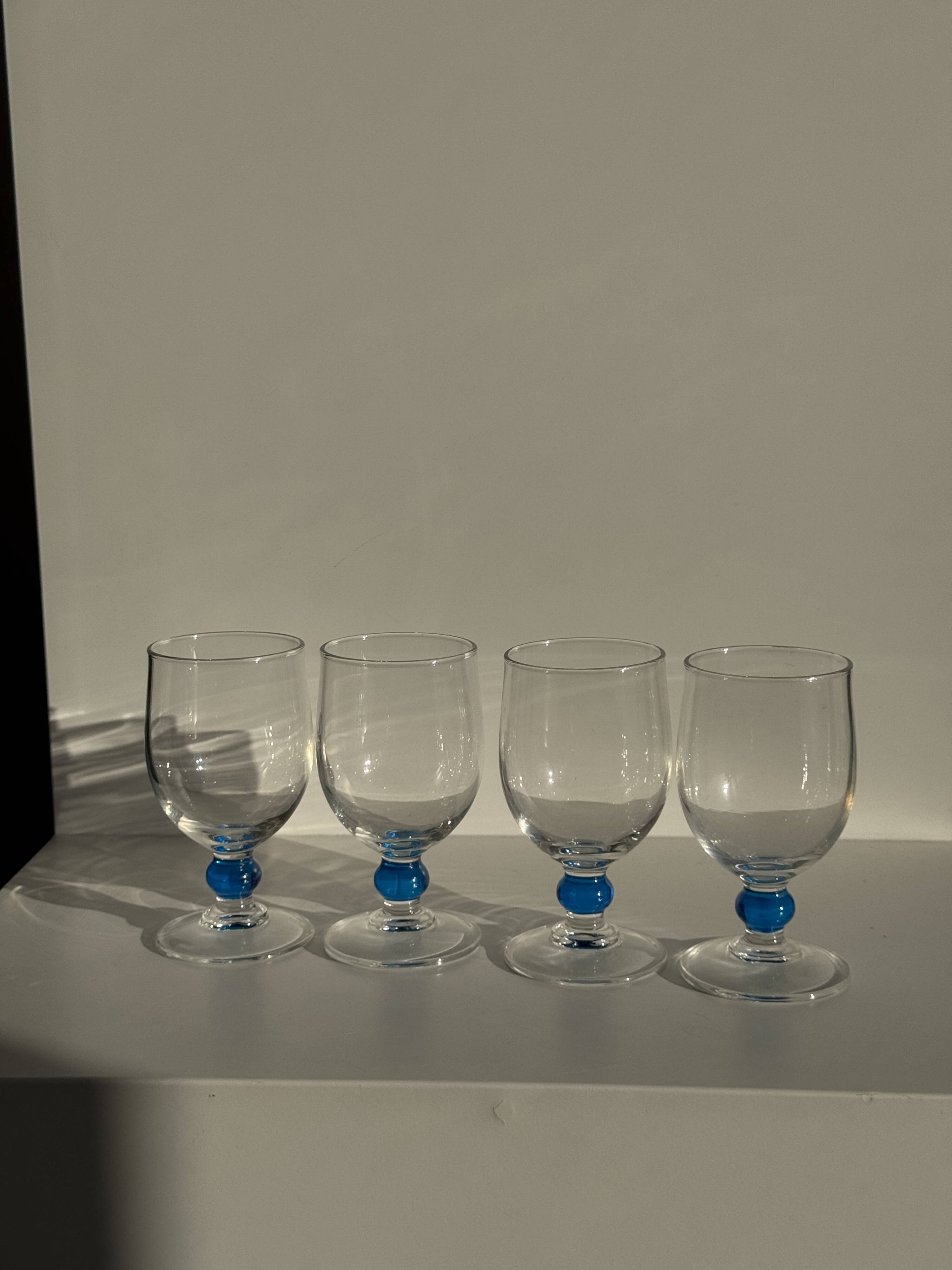 Set of 4 blue ball stemmed water glasses