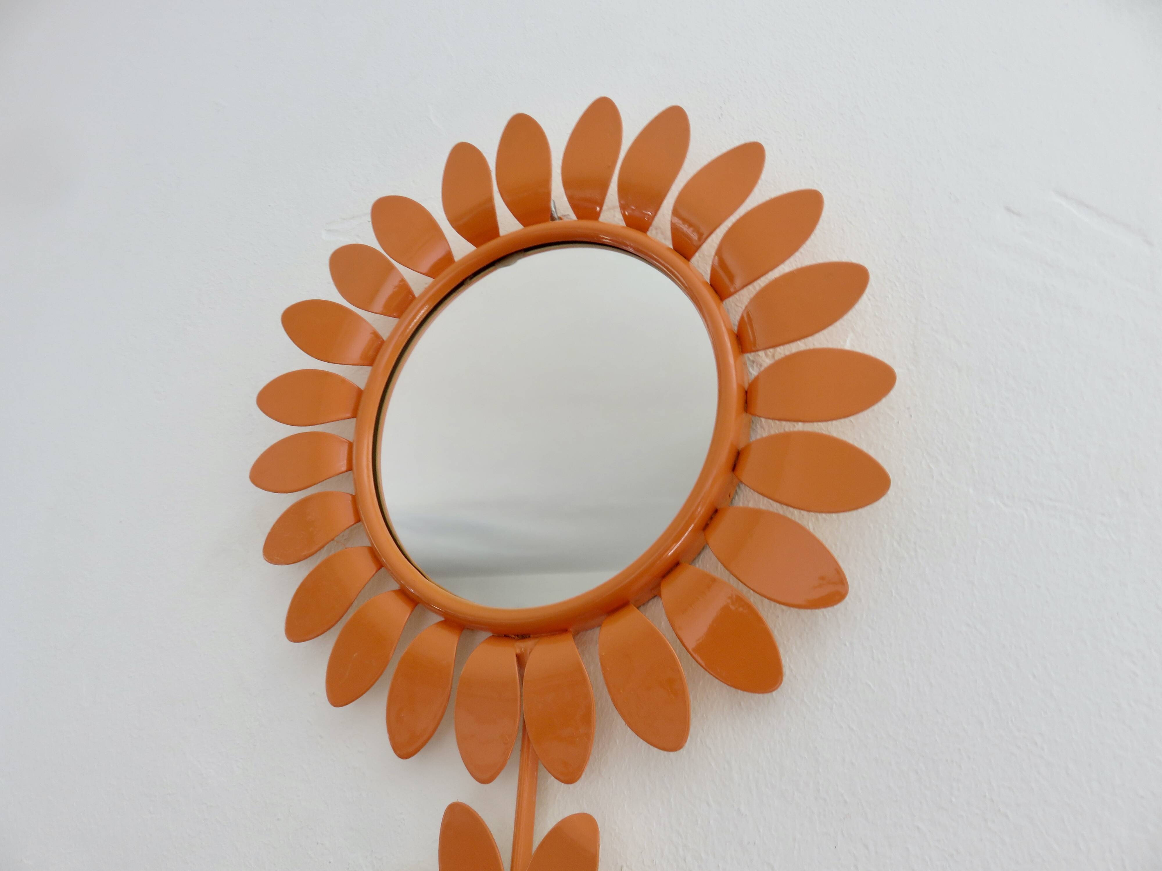 Large 1970s "flower" mirror in orange metal