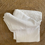 Old white cotton tablecloth.