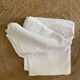 Old white cotton tablecloth.