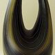 Earthenware vase decorated with yellow lines on a black and yellow background