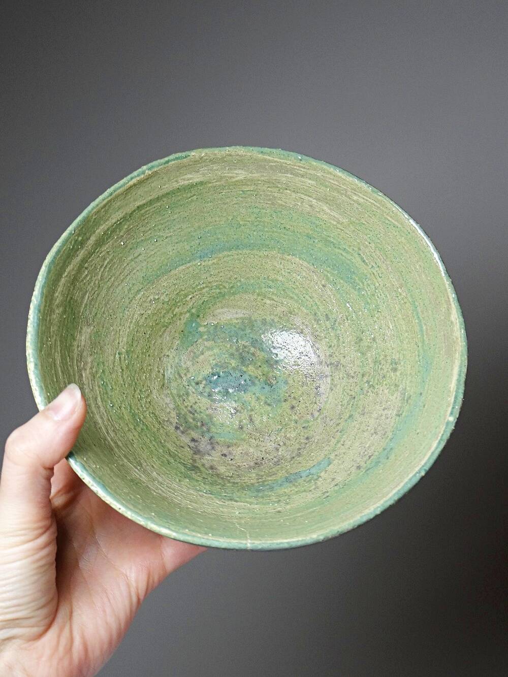 Wabi-Sabi handcrafted ceramic bowl in celadon green, 20th-19th century.