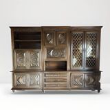 Wooden dresser with glass display cases and TV area with rotating tray