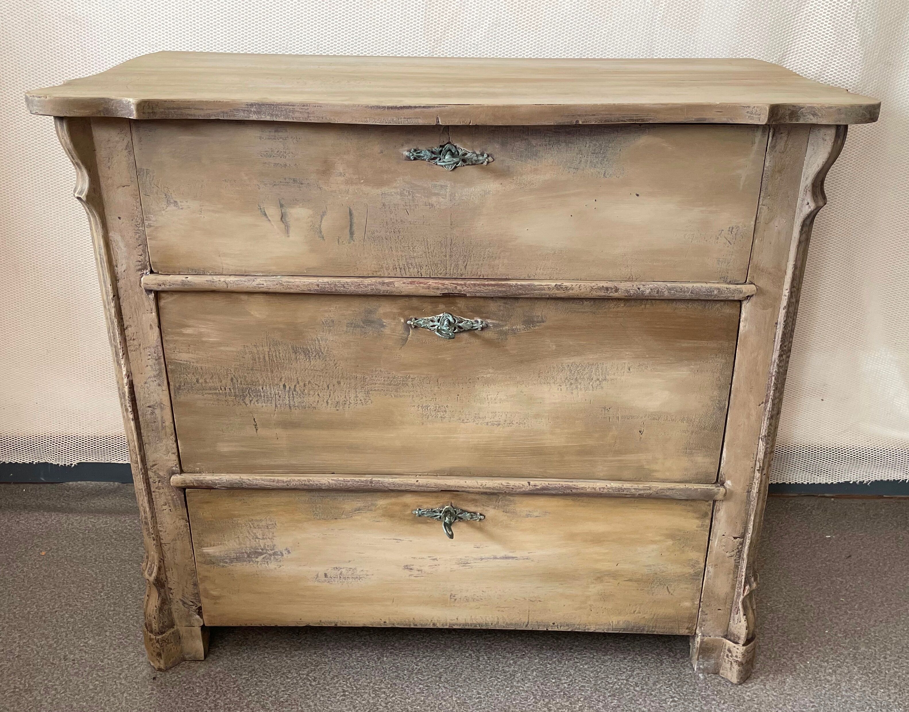 Patinated baroque crossbow chest of drawers