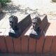 Pair of cast-iron chenet characters with laurels