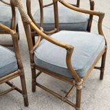 Set of 4 vintage McGuire rattan chairs with cushions.