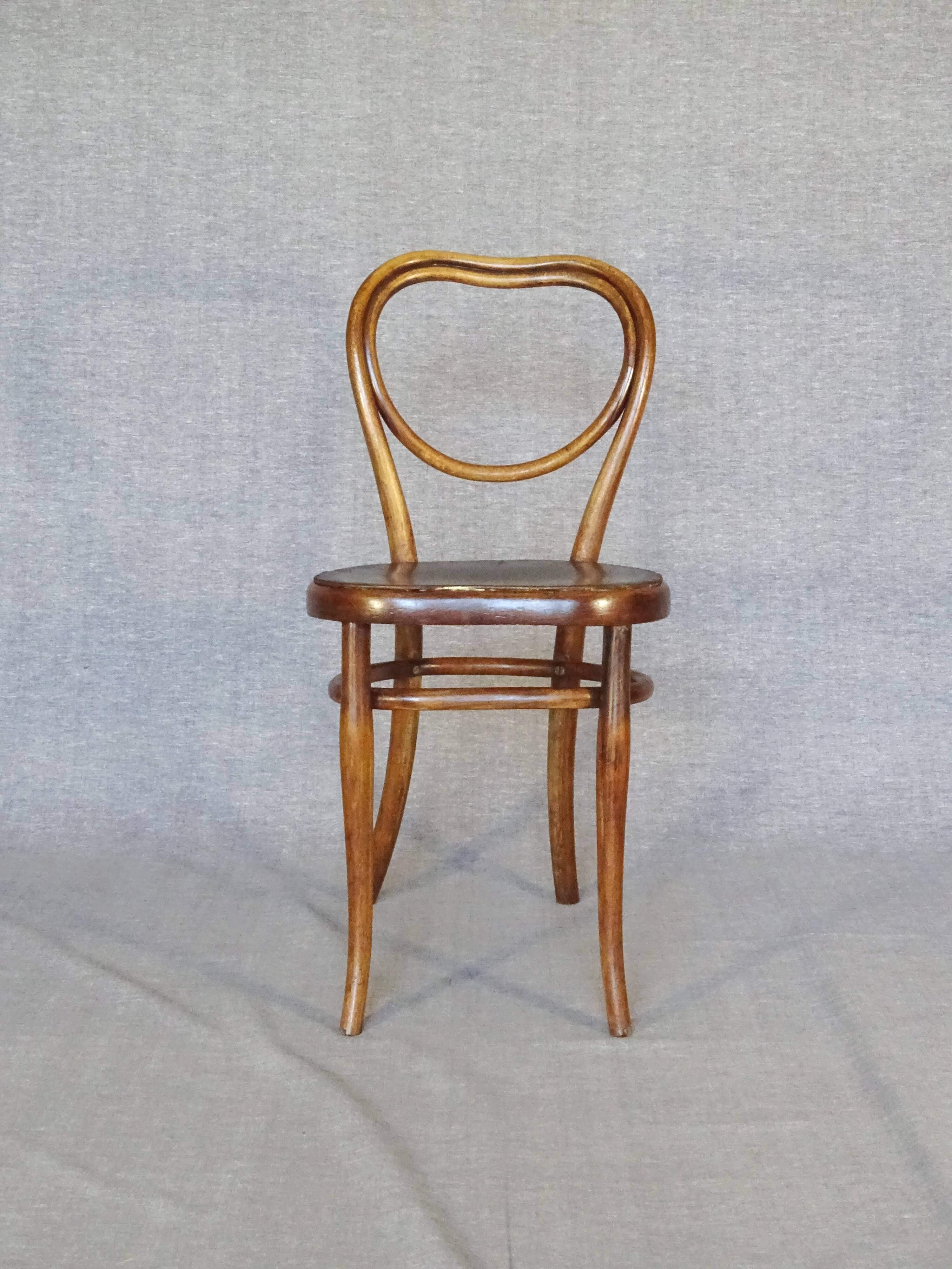 Set of 4 mismatched bistro chairs, 1900 to 1930 with wooden seats, Thonet, Baumann
