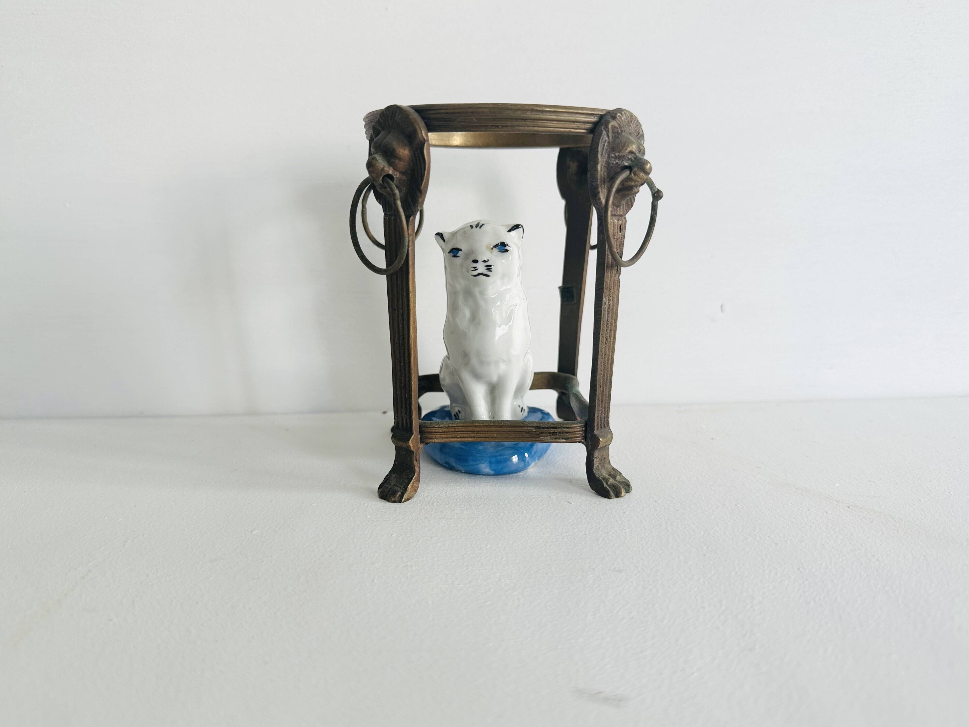 Small ancient glazed ceramic cat from the 19th century.