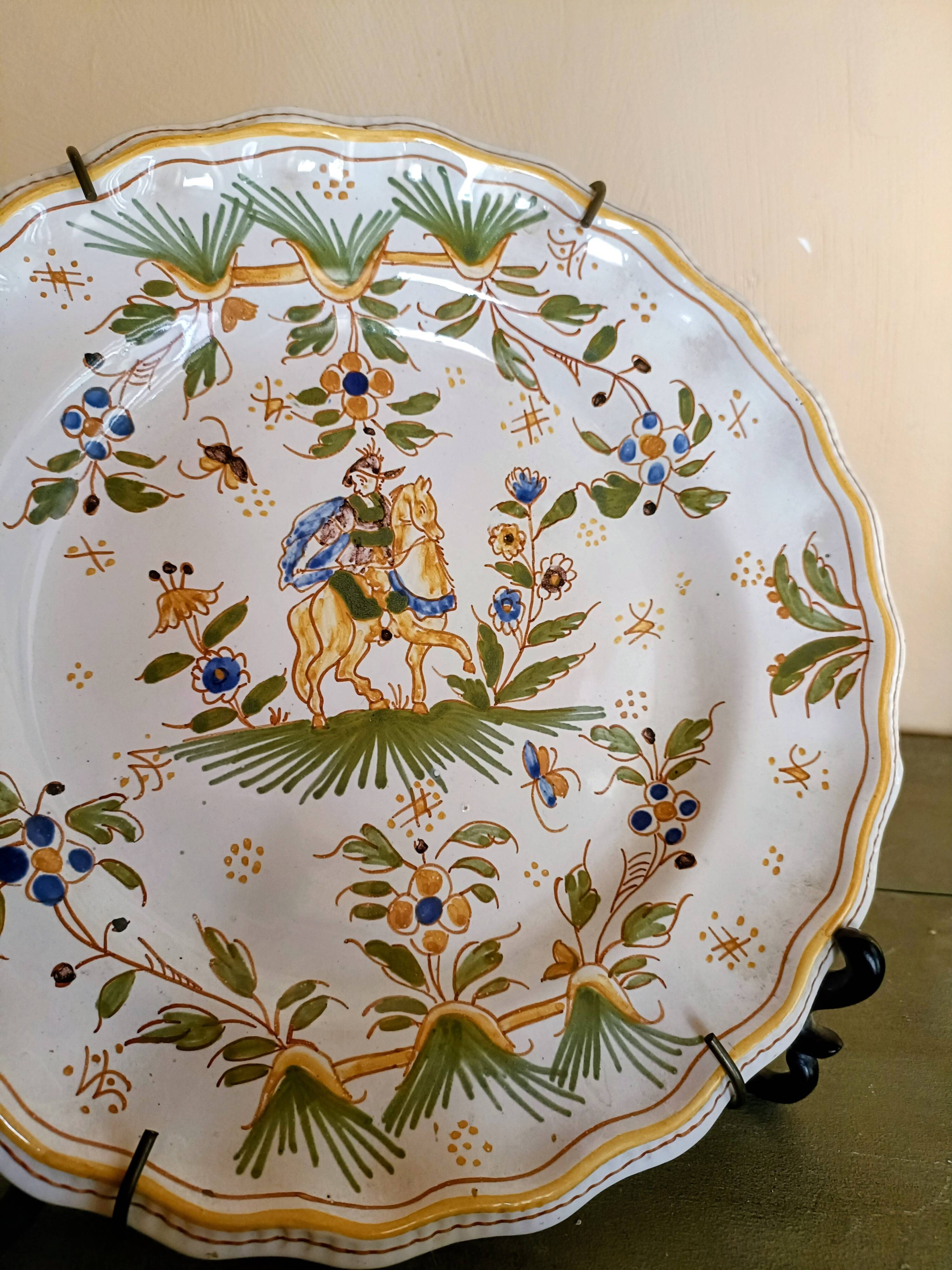 Antique Moustiers plate hand-decorated with a horseman.