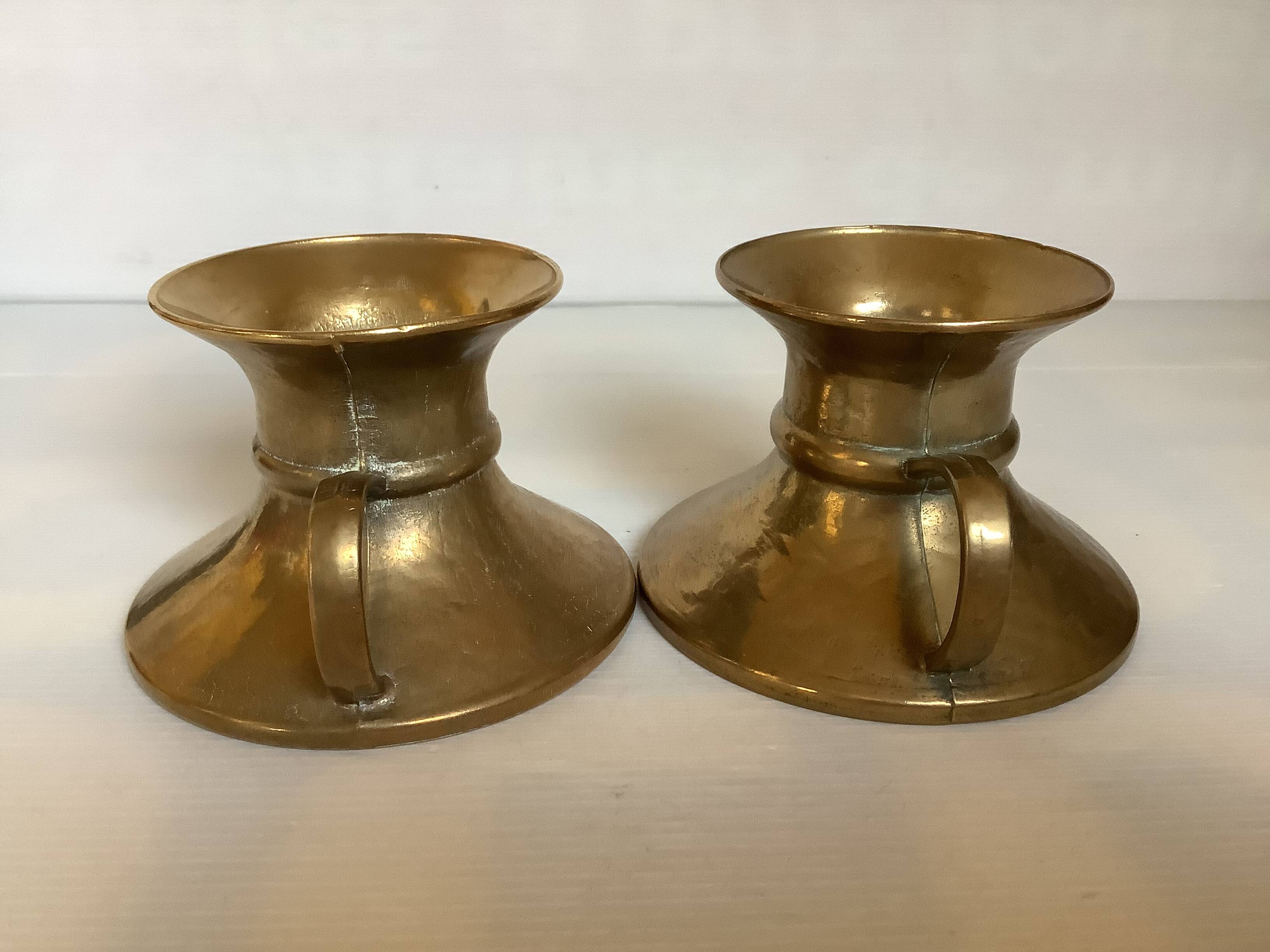 Pair of rat cave candlesticks with tulip base in bronze.