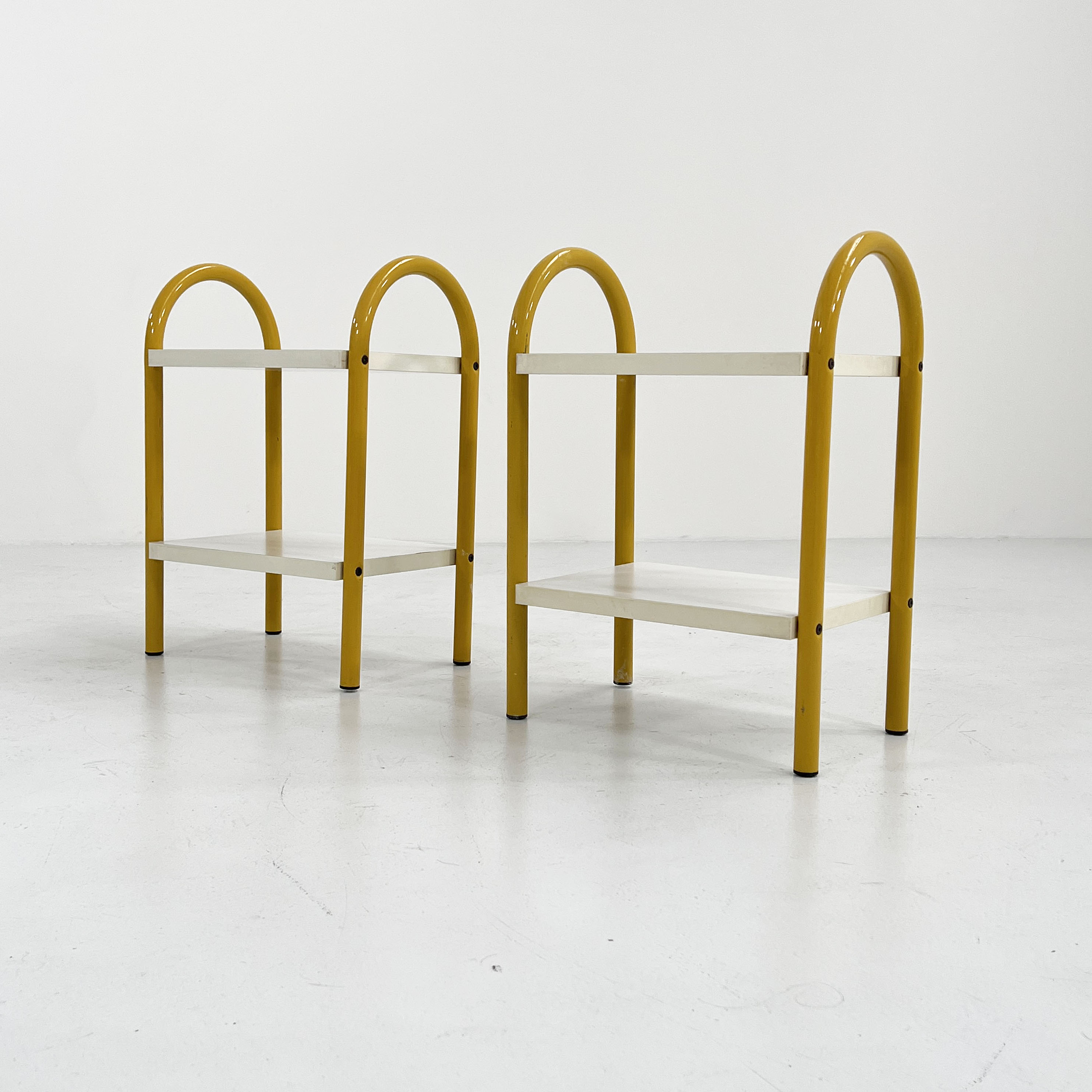 Pair of yellow tubular bedside tables, 1980