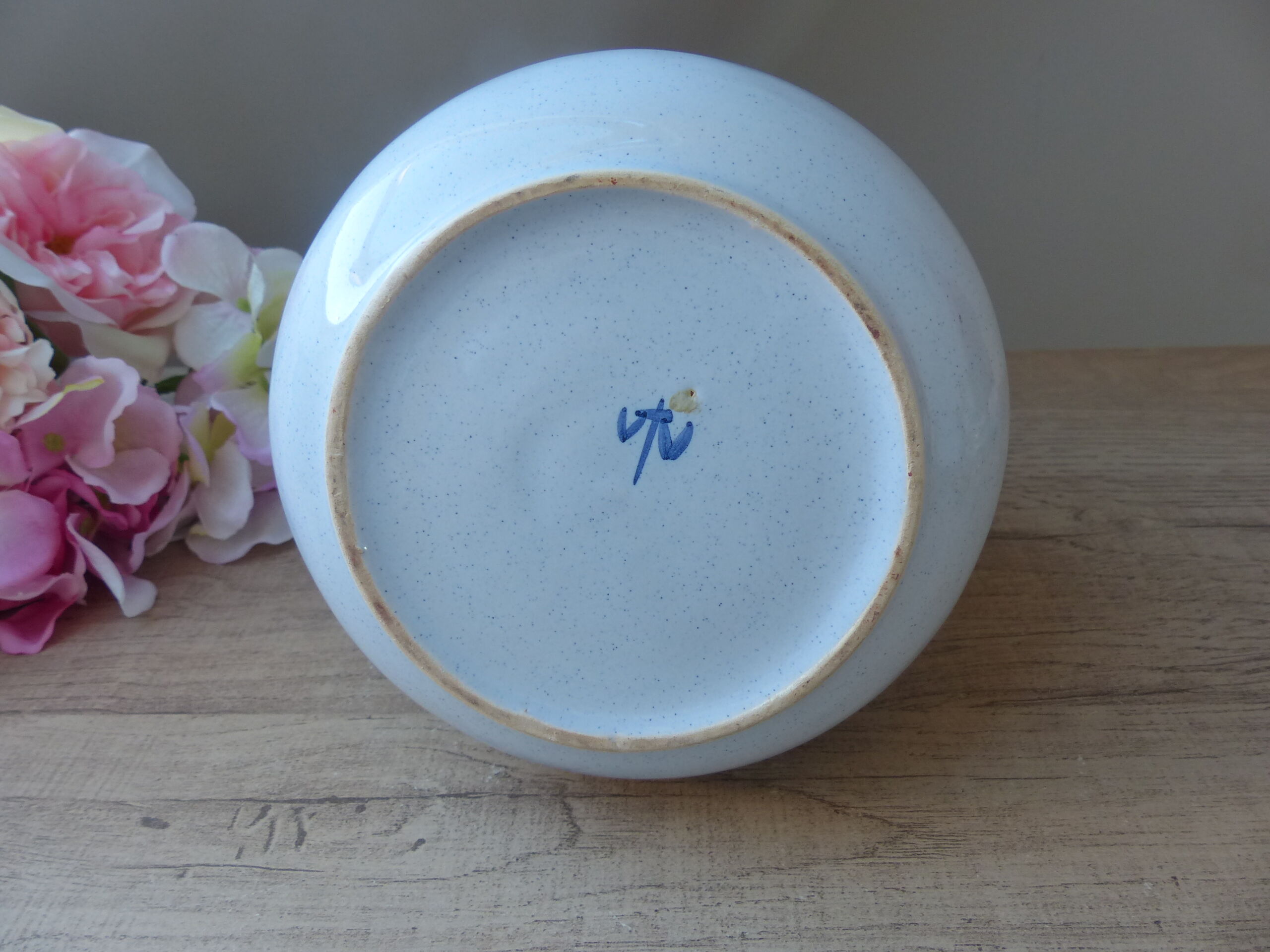 Vintage blue ceramic jug with hand-painted floral decoration.