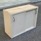 Vintage wall-mounted kitchen cabinet with sliding doors in 1960s retro style.