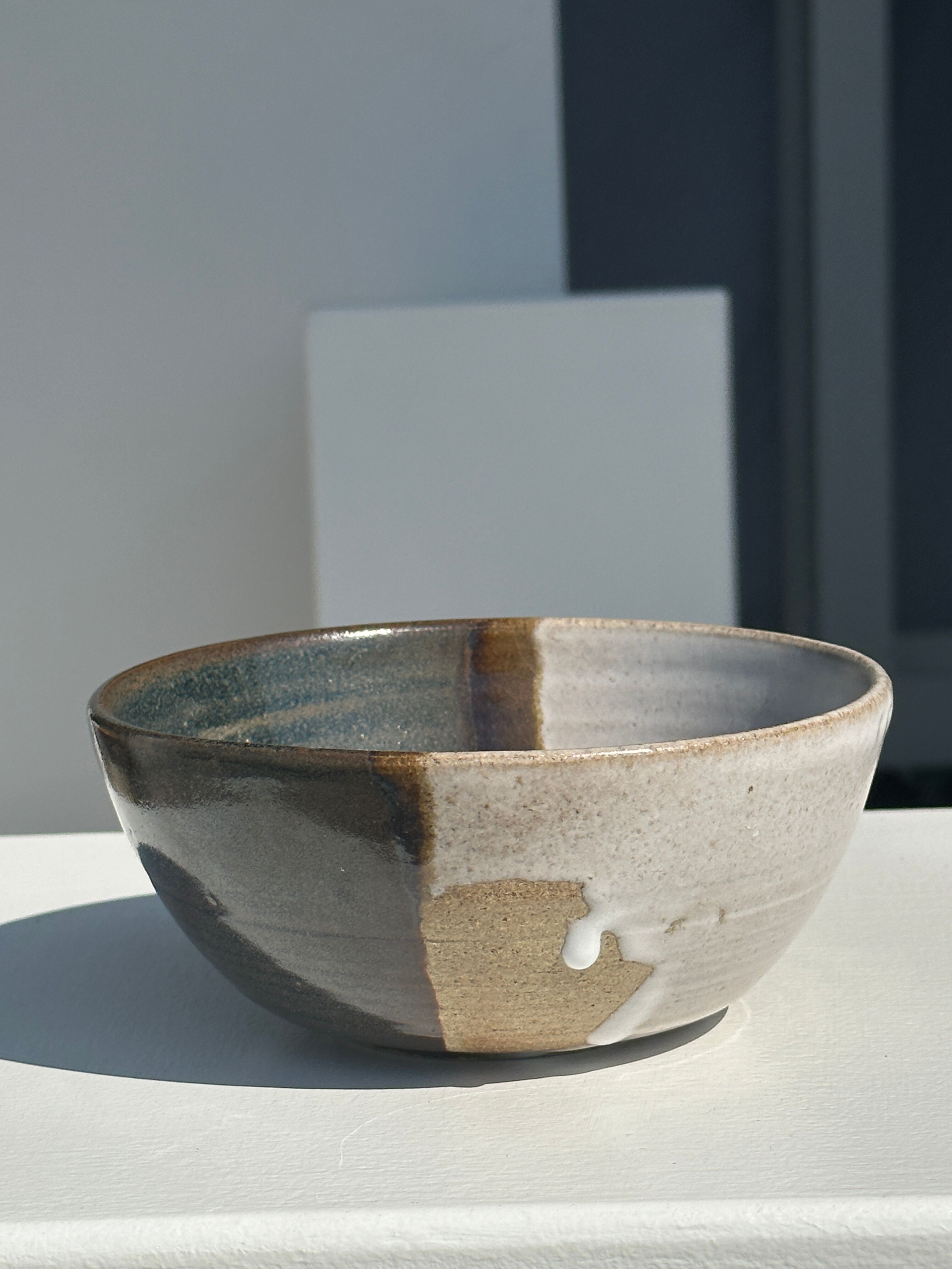 White and glossy brown two-tone ceramic bowl, matt earth