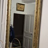 Large antique mirror from the Napoléon III era, finely carved and gilded with gold leaf.
