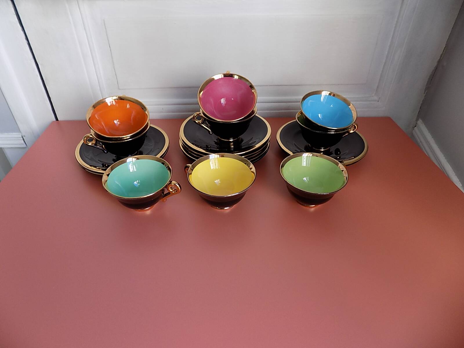 set of 9 black and gold Salins cups and saucers