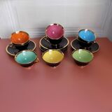 set of 9 black and gold Salins cups and saucers