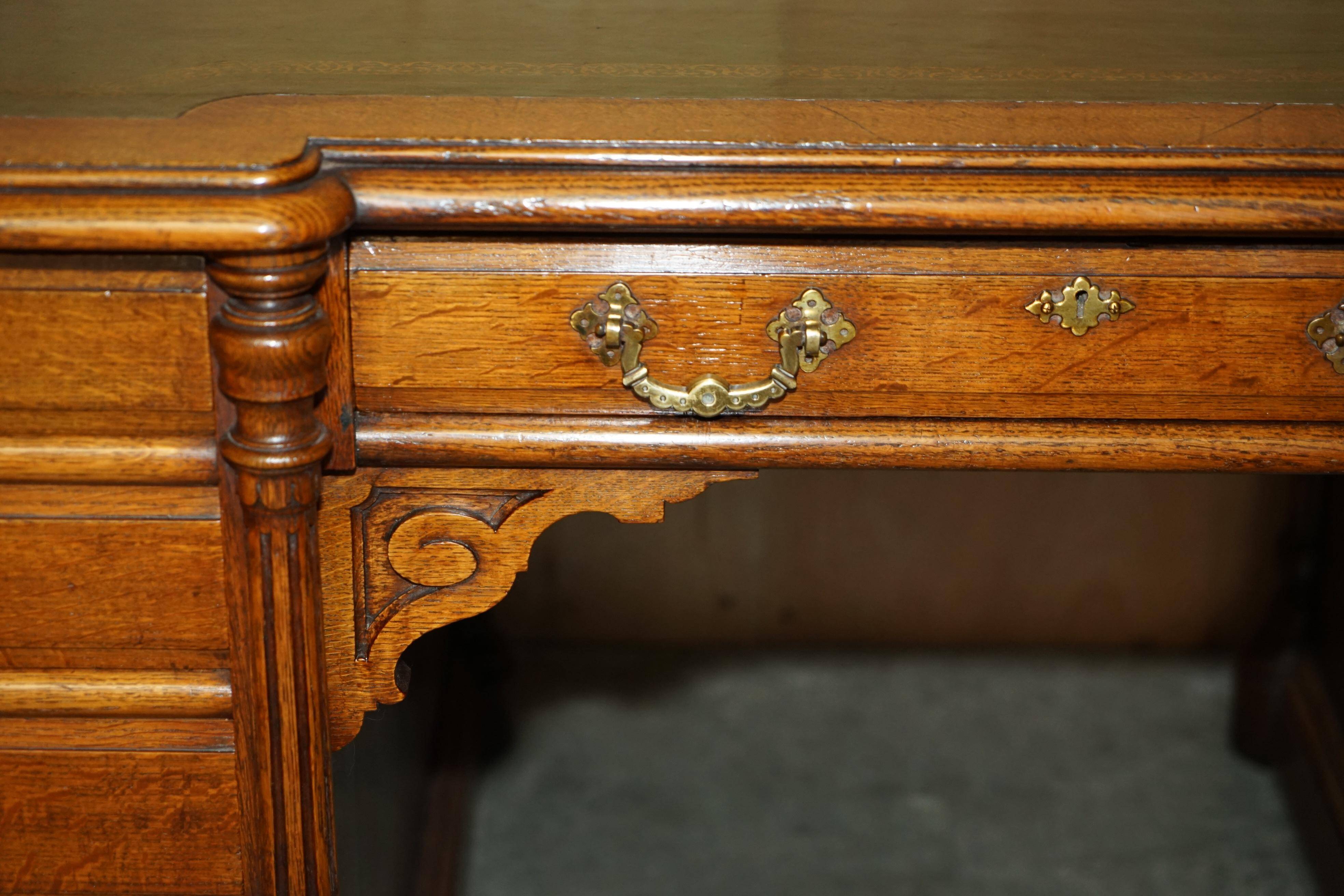 Antique double-sided desk C Hindley & Son in oak and leather