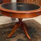 Circular table in solid mahogany and black leather claw base Restoration