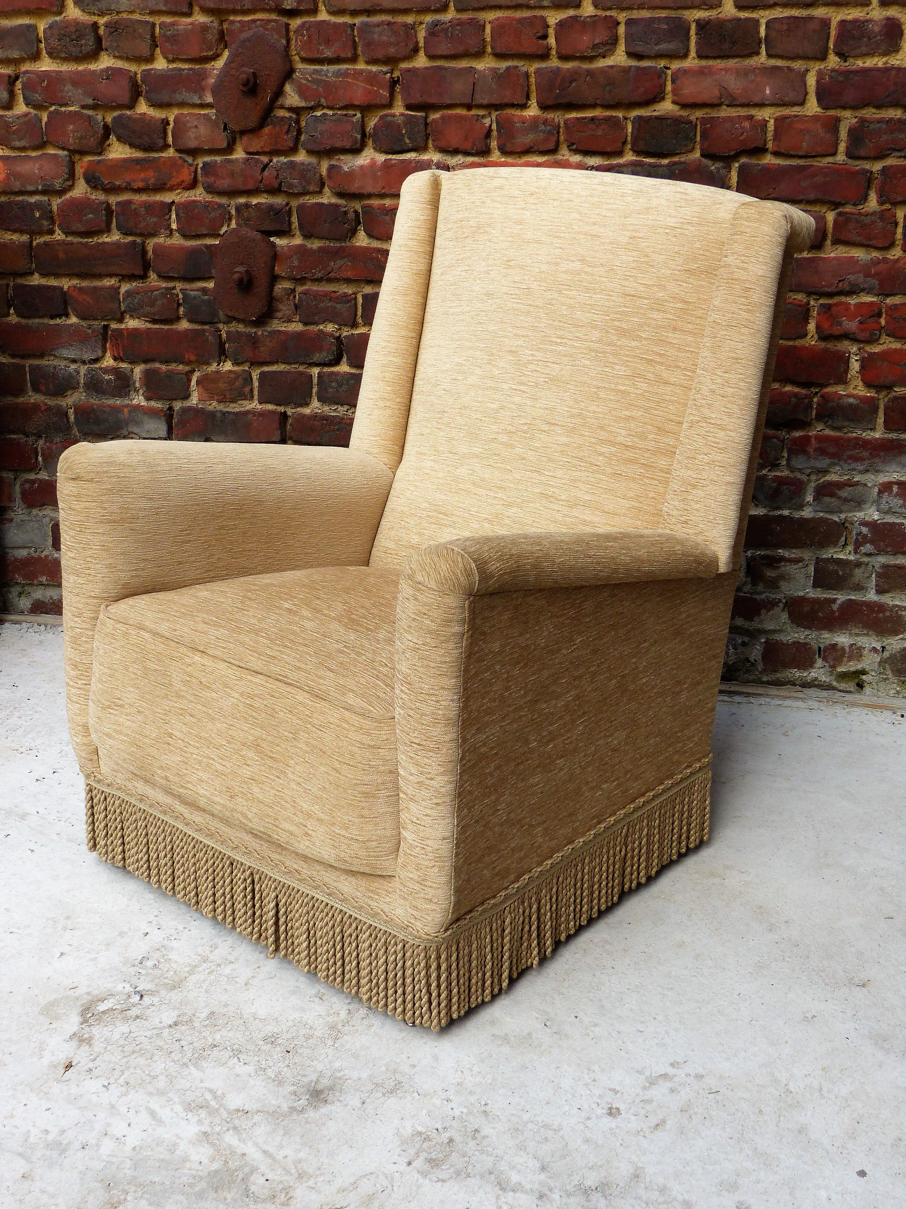Fauteuil en velour beige et franges