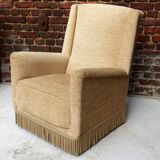 Fauteuil en velour beige et franges