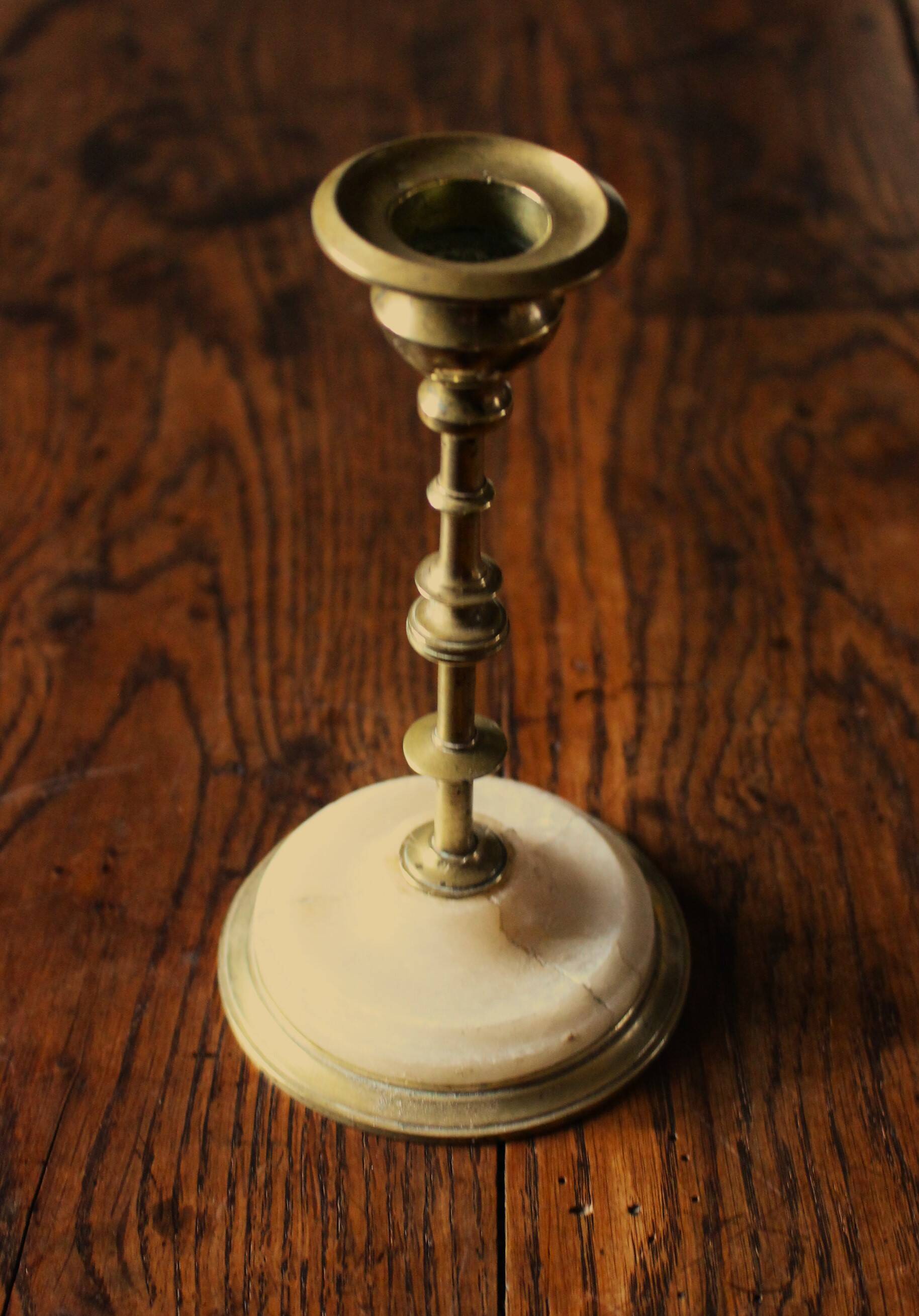 Fine brass candle holder alabaster base