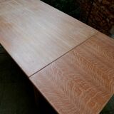 wooden dining table with compass legs and extensions