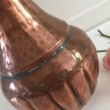 Pitcher-shaped vase in hammered copper