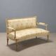 Antique neoclassical canapé in carved wood from the 19th century.