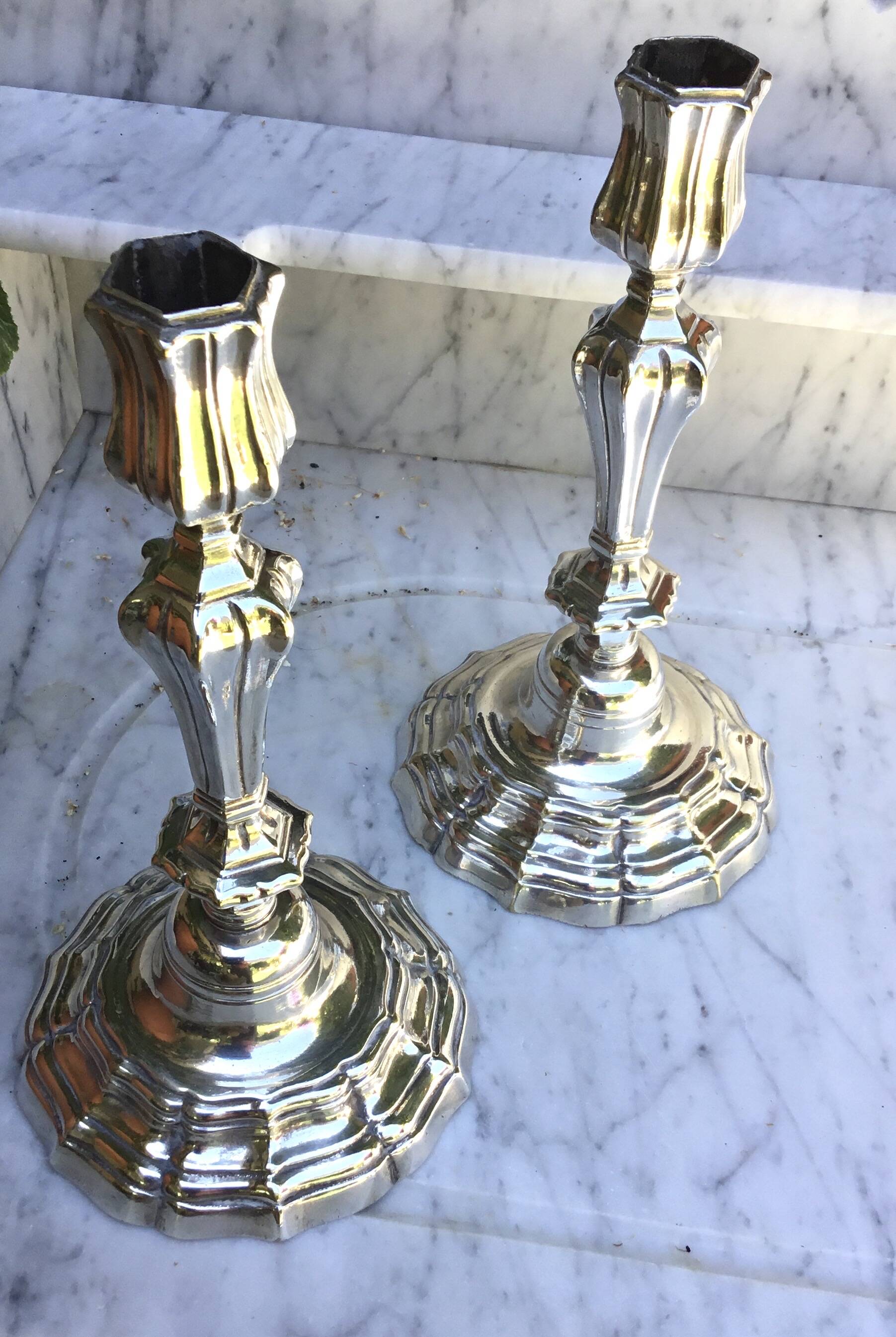 Pair of silvered metal candlesticks in the Louis XIV style.