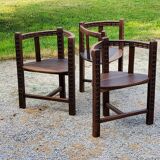 Set of three brutalist tripod armchairs in carved solid oak