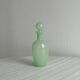 Opaque light green glass vial