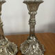 Pair of pressed glass candlesticks with silver plating.