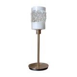 Table lamp with gold metal base and cylindrical textured glass shade