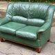 Vintage 2-seater sofa in green leather and solid wood
